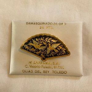 24K gold pin with black inlay and gold birds